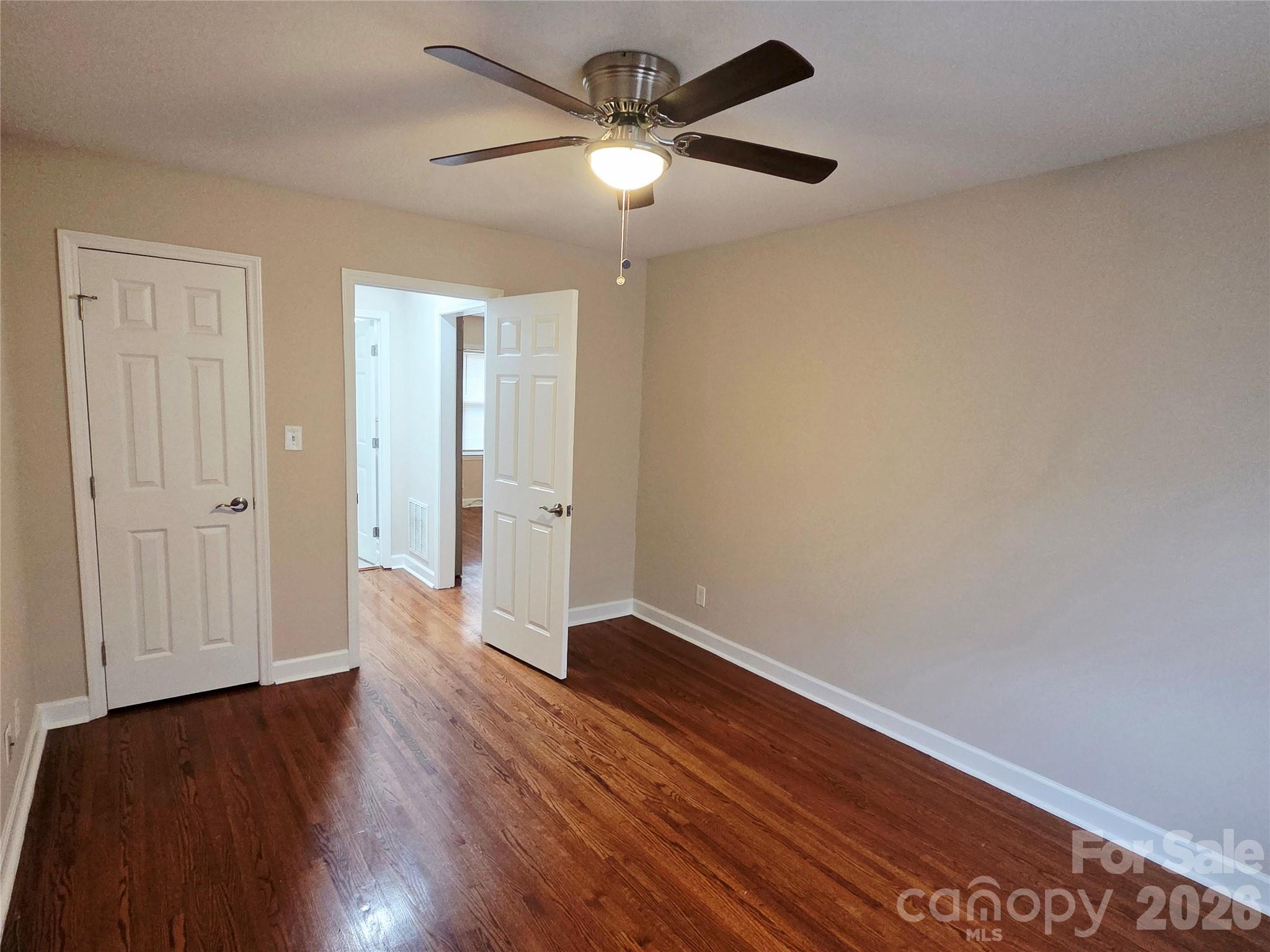 3500 North Sharon Amity Road Charlotte, NC 28212 - Photo 5 of 16 a view of an empty room with wooden floor