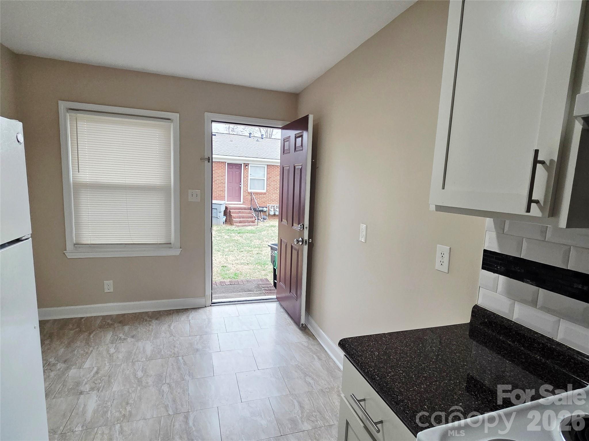 3500 North Sharon Amity Road Charlotte, NC 28212 - Photo 10 of 16 an empty room with windows