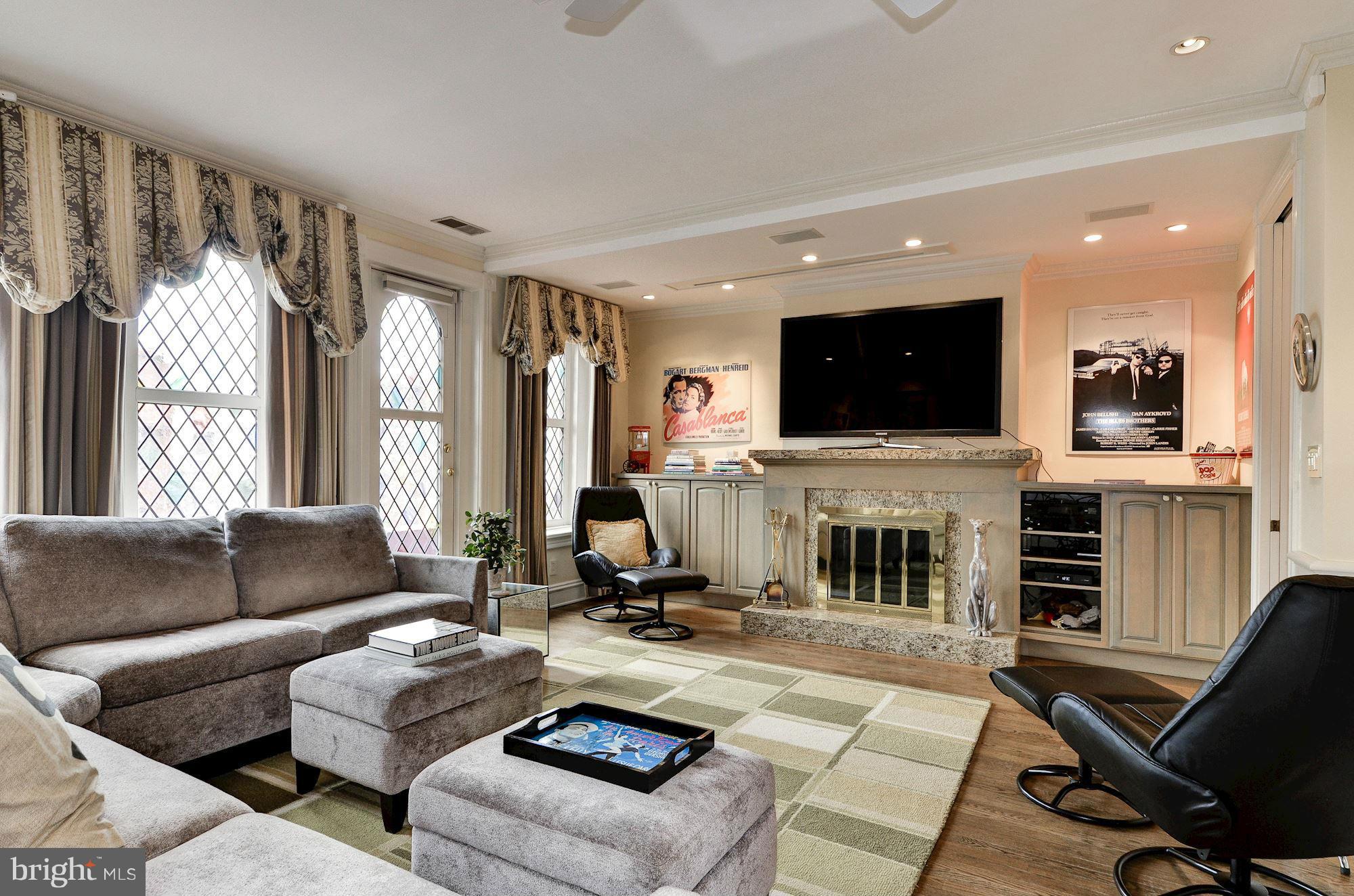1733 Q Street Northwest Washington, DC 20009 - Photo 12 of 15 a living room with furniture fireplace and flat screen tv