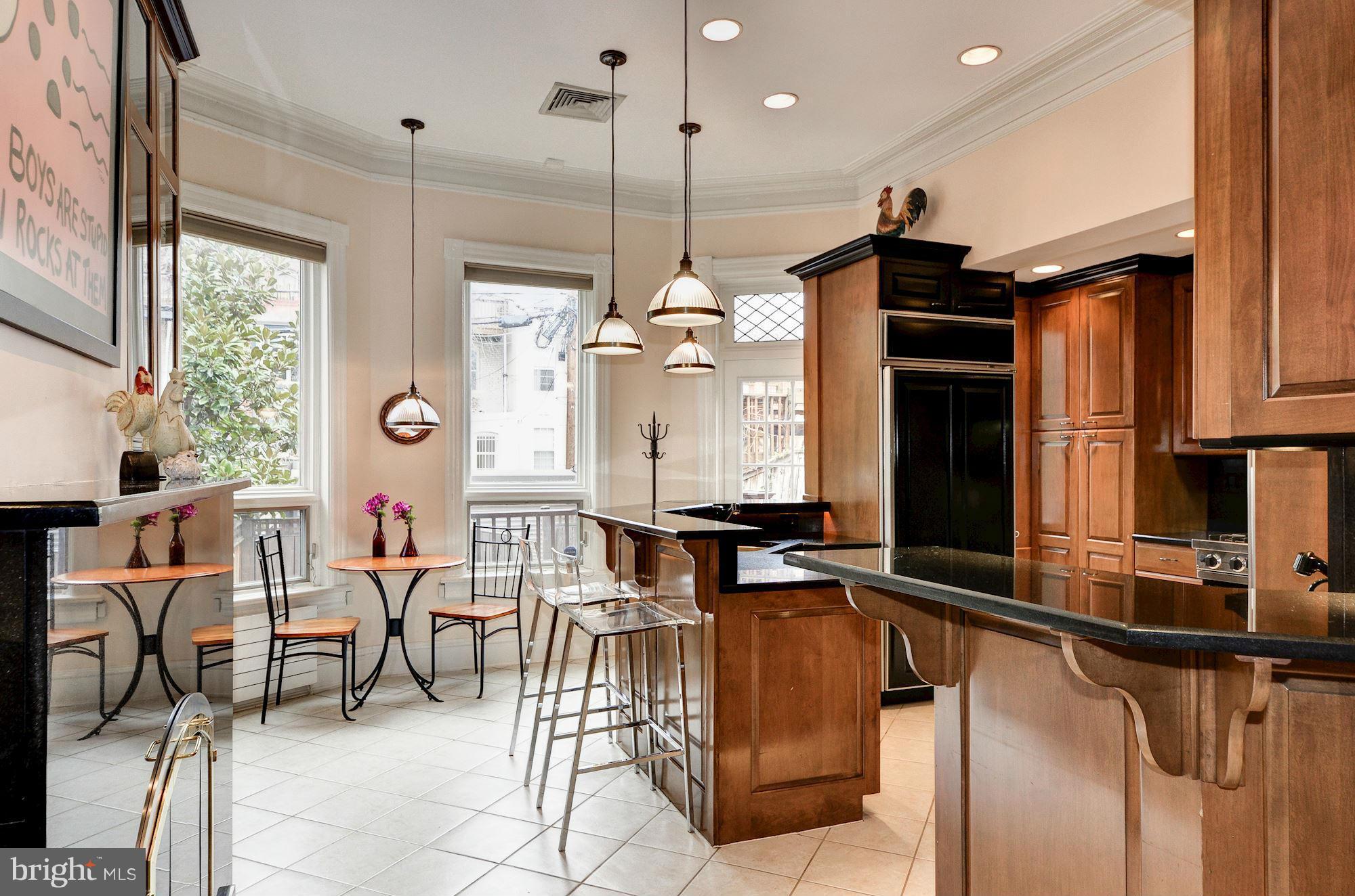 1733 Q Street Northwest Washington, DC 20009 - Photo 6 of 15 a view of a dining room with furniture window and outside view