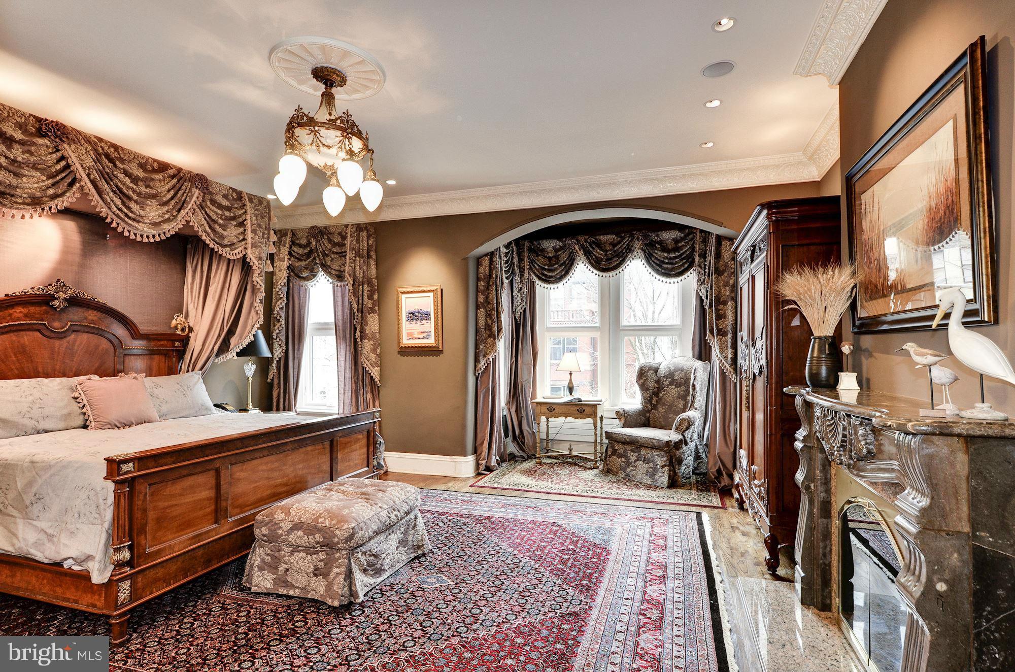 1733 Q Street Northwest Washington, DC 20009 - Photo 8 of 15 a bedroom with furniture and a chandelier