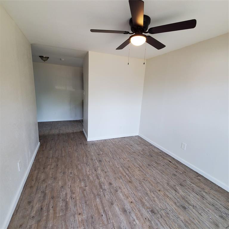4205 Metropolitan Avenue Dallas, TX 75210 - Photo 2 of 6 a view of empty room with wooden floor