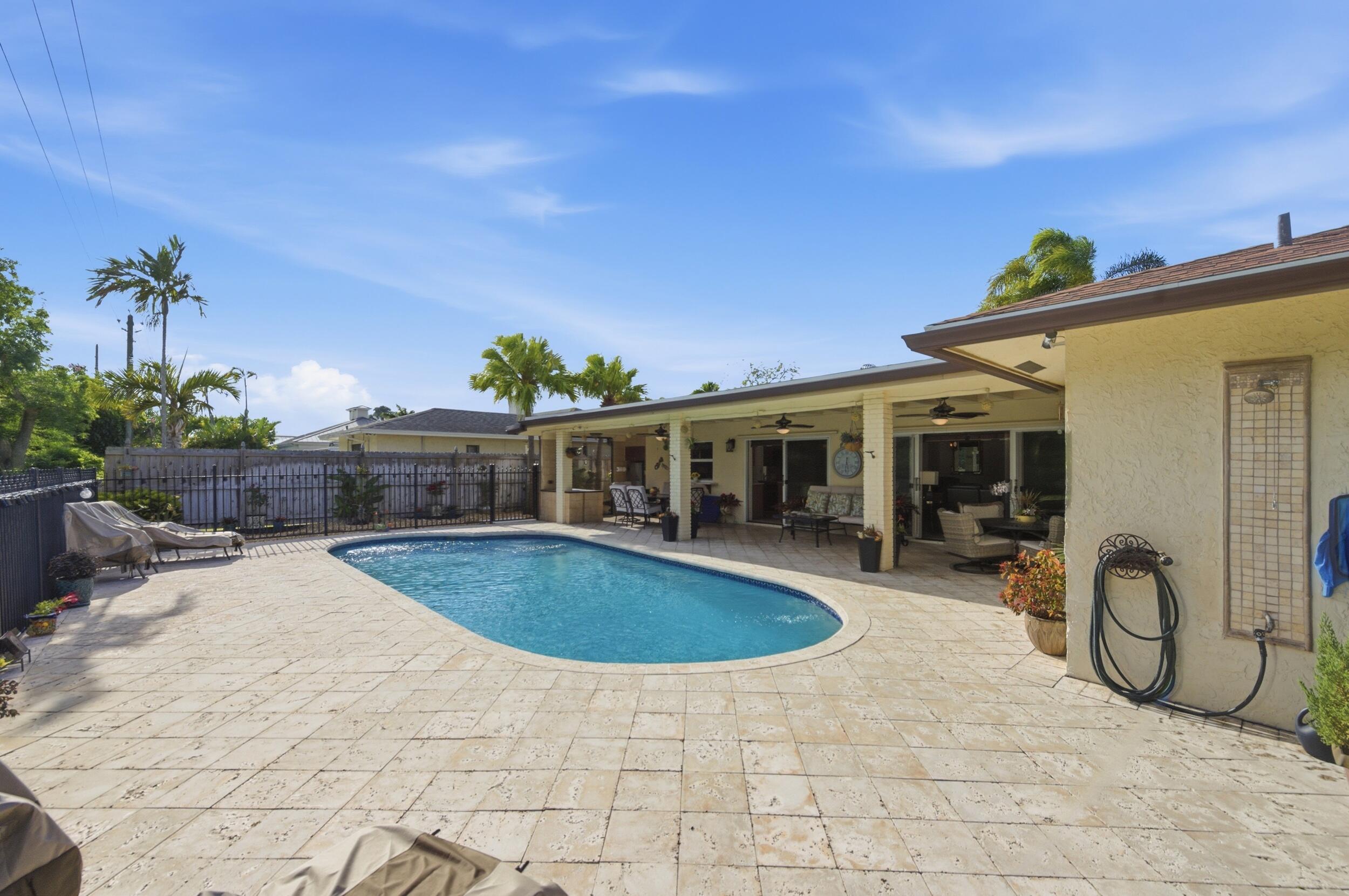 4780 Brandywine Drive Boca Raton, FL 33487 - Photo 30 of 43 a view of patio with swimming pool and furniture