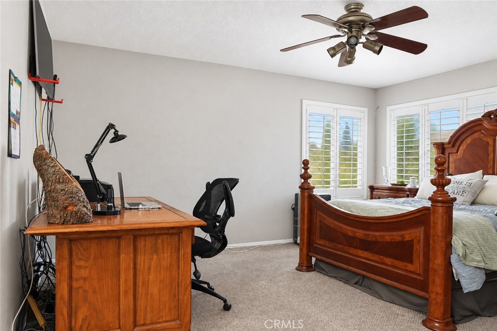 2164 North Date Avenue Rialto, CA 92377 - Photo 10 of 20 Spacious primary bedroom with plantation shutters, abundant natural light and room for a comfortable sitting area or additional furnishings.