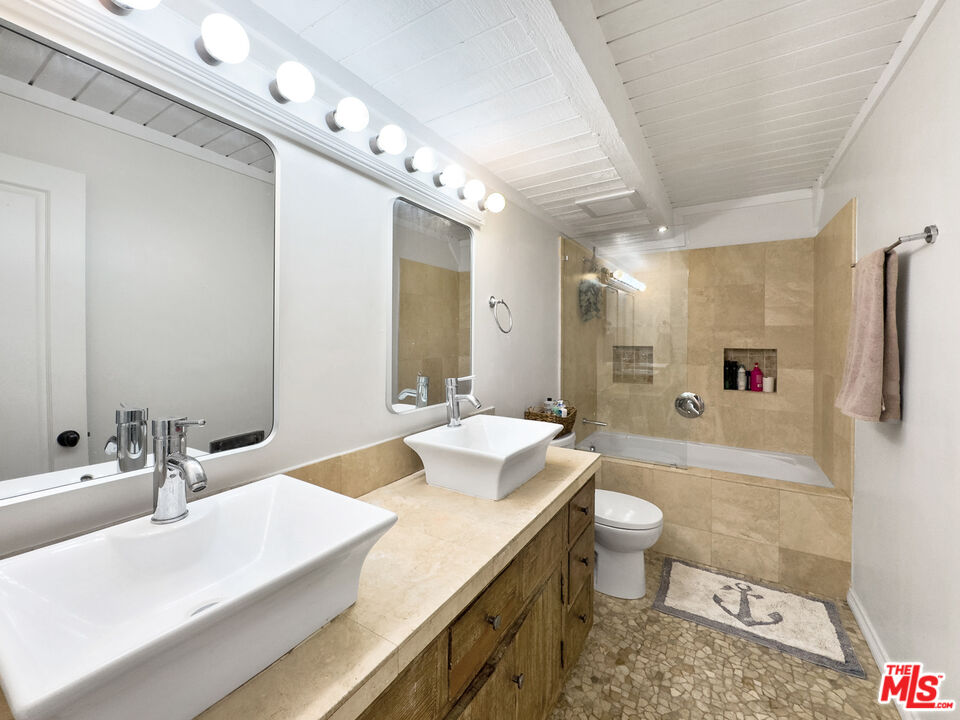 22012 Topanga School Road Topanga, CA 90290 - Photo 16 of 34 a bathroom with a sink a toilet and shower