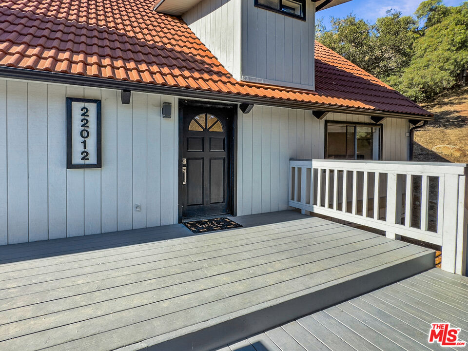 22012 Topanga School Road Topanga, CA 90290 - Photo 18 of 34 a view of a house with wooden deck