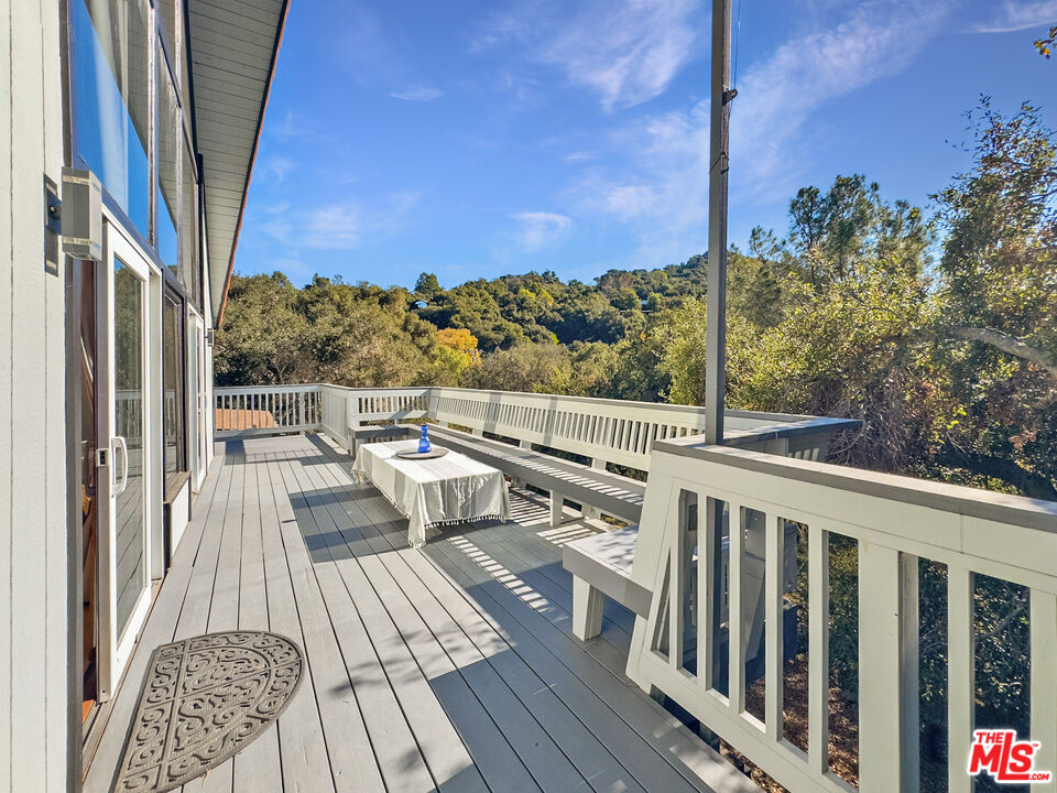 22012 Topanga School Road Topanga, CA 90290 - Photo 20 of 34 a view of balcony with wooden floor and fence