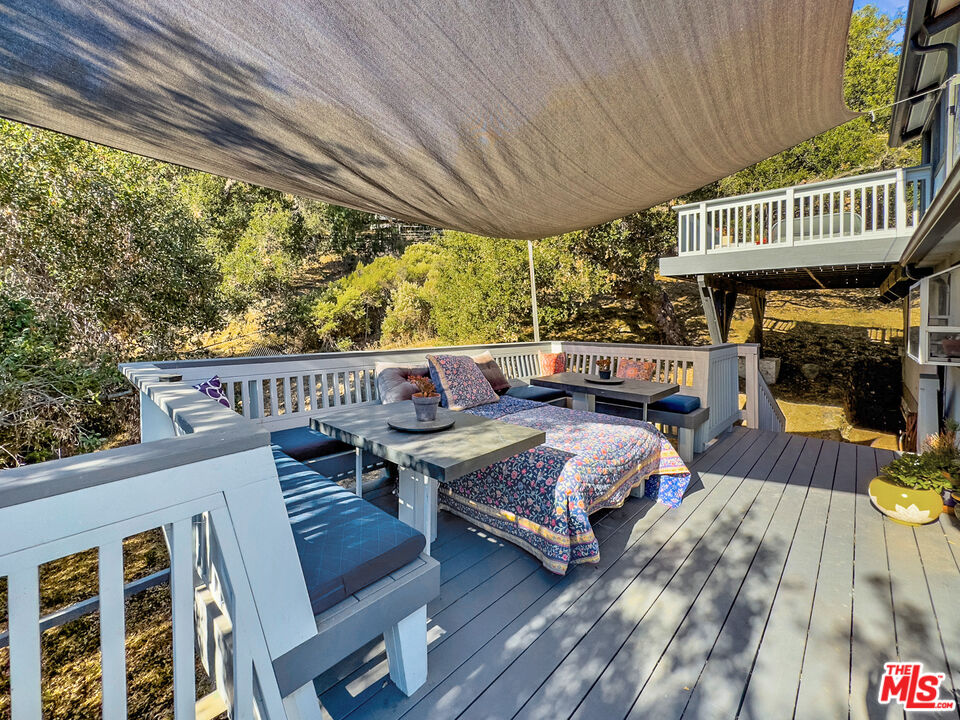 22012 Topanga School Road Topanga, CA 90290 - Photo 21 of 34 a view of a patio with couches next to a yard
