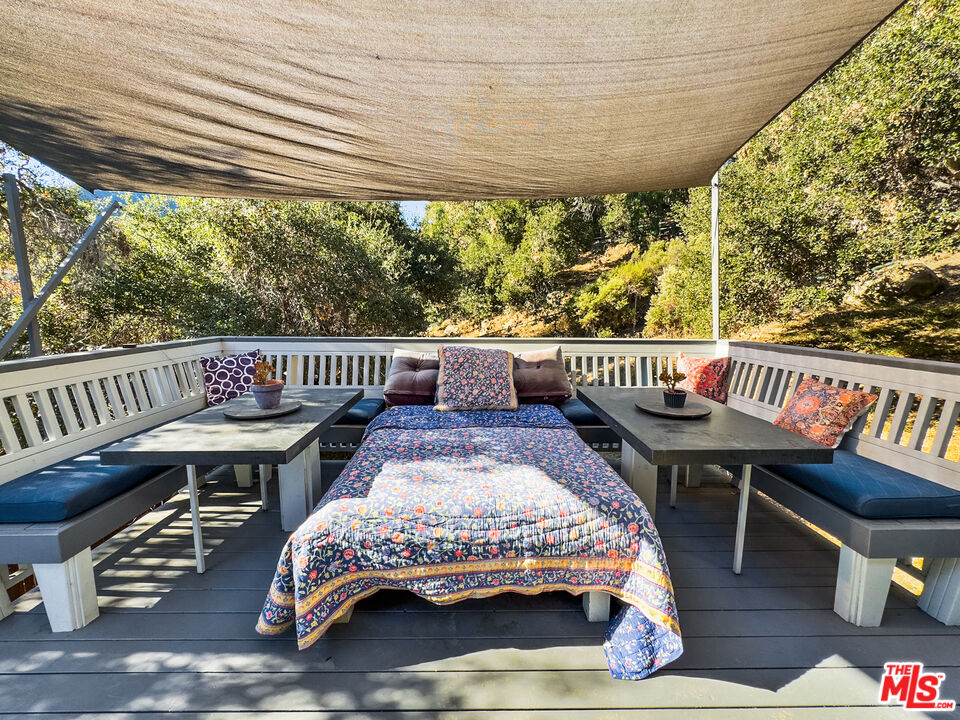 22012 Topanga School Road Topanga, CA 90290 - Photo 22 of 34 a view of balcony with deck and outdoor seating