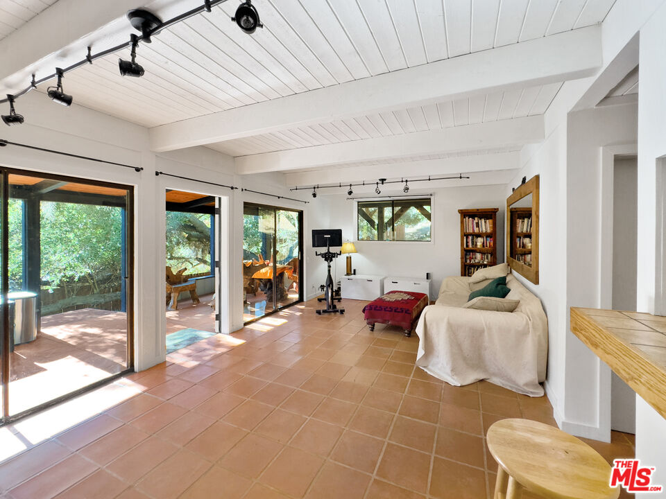 22012 Topanga School Road Topanga, CA 90290 - Photo 25 of 34 a living room with furniture and large windows