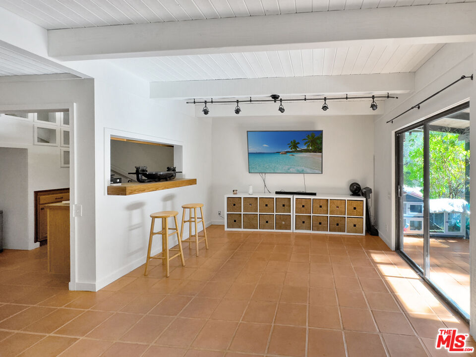 22012 Topanga School Road Topanga, CA 90290 - Photo 26 of 34 a living room with a flat screen tv and outdoor view