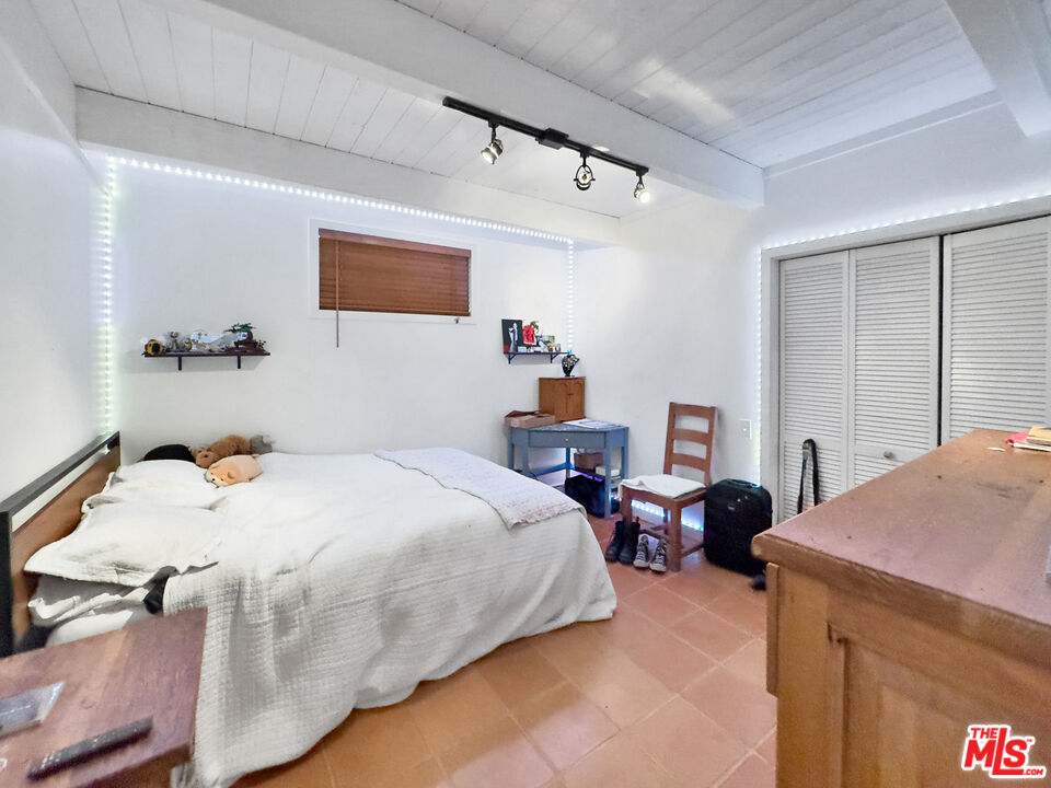 22012 Topanga School Road Topanga, CA 90290 - Photo 28 of 34 a bedroom with a bed and a dresser