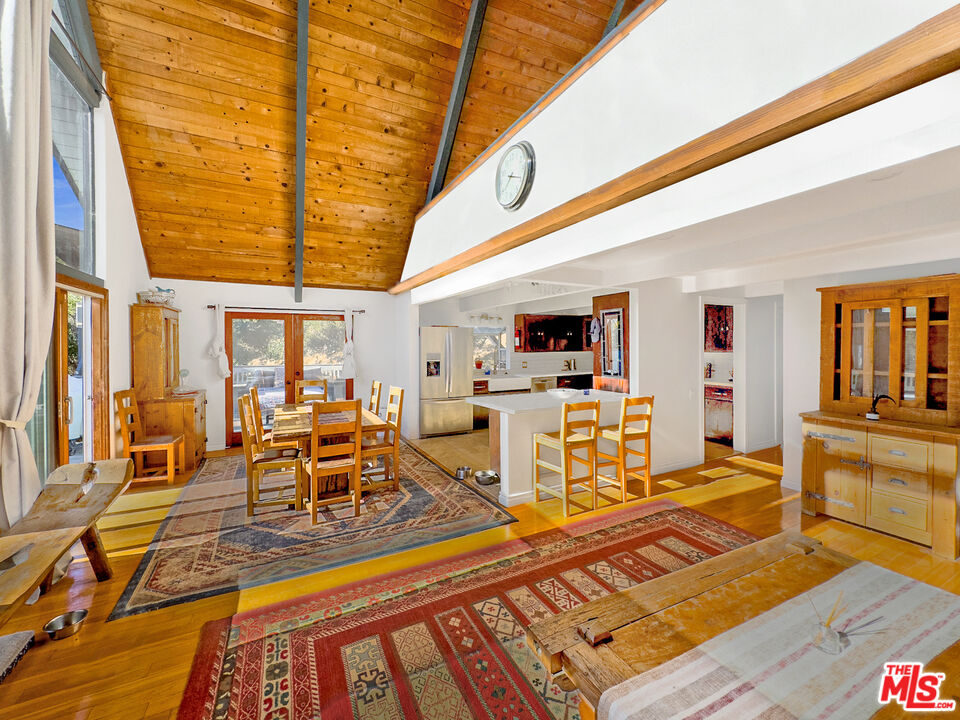22012 Topanga School Road Topanga, CA 90290 - Photo 3 of 34 a living room with lots of furniture and wooden floor