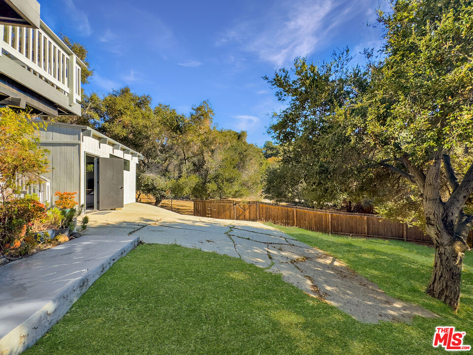 22012 Topanga School Road Topanga, CA 90290 - Photo 31 of 34 a view of a house with backyard and sitting area