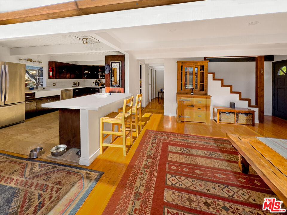 22012 Topanga School Road Topanga, CA 90290 - Photo 4 of 34 a view of a living room and kitchen