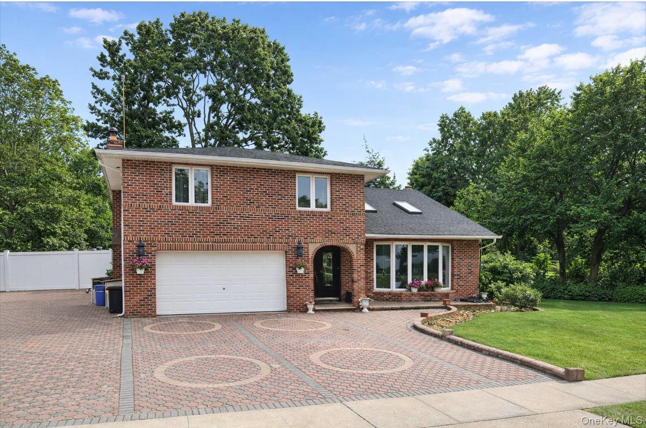48 Robin Lane Plainview, NY 11803 - Photo 1 of 1 front view of a house with a garden