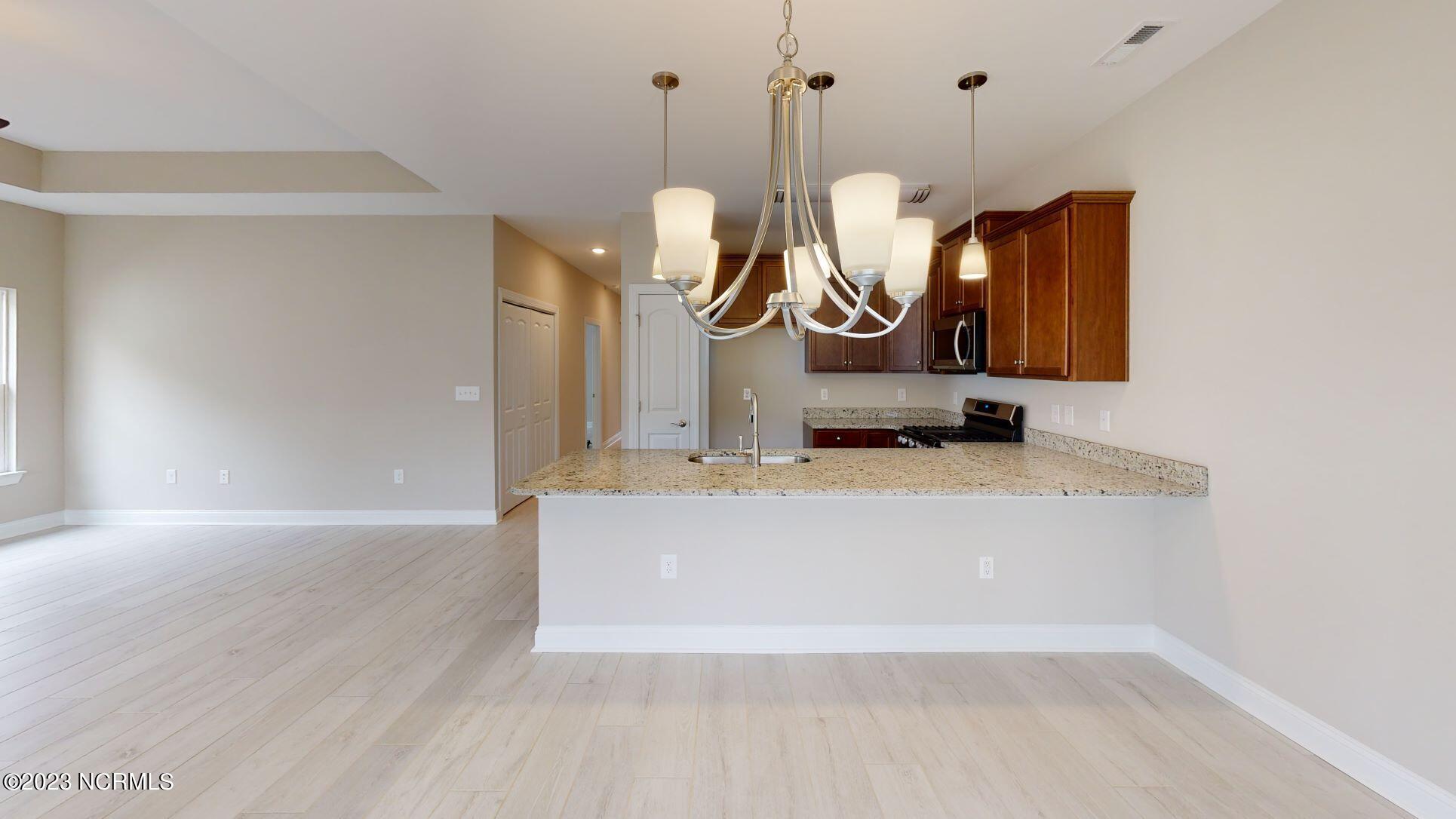 7633 Privateer Loop Sunset Beach, NC 28468 - Photo 12 of 32 Pictures, photographs, colors, features, and sizes are for illustration purposes only and will vary from the homes as built.