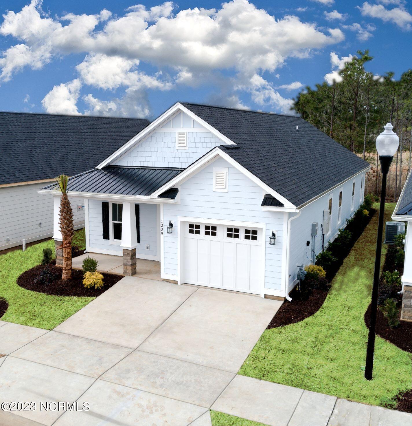 7633 Privateer Loop Sunset Beach, NC 28468 - Photo 7 of 32 Pictures, photographs, colors, features, and sizes are for illustration purposes only and will vary from the homes as built.