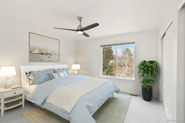 a bedroom with a large bed and a window