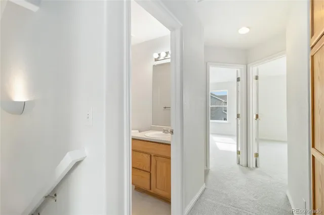 a en suite bathroom with a sink and a mirror