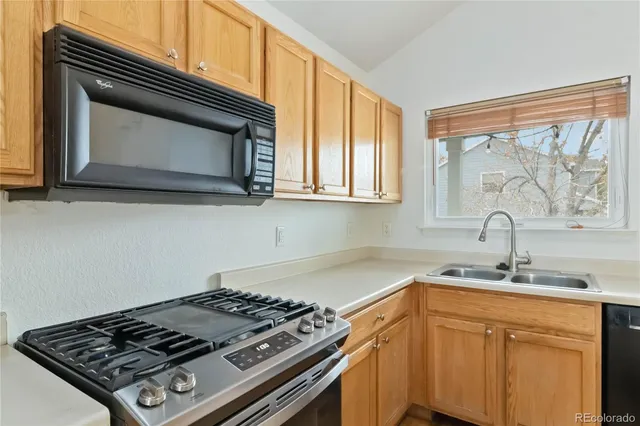 a kitchen with a stove and a microwave