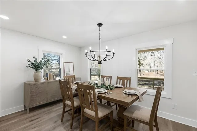 a kitchen with a sink stainless steel appliances and white cabinets