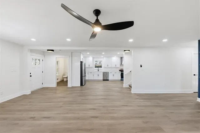 a white stove top oven sitting inside of a kitchen