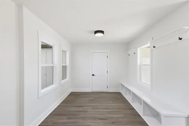 a view of an empty room and bathroom