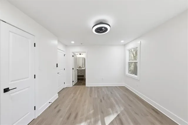 a view of an empty room and closet area