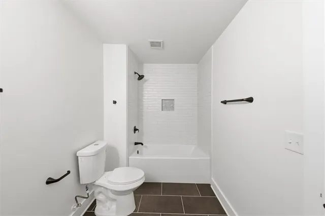 a view of an house with backyard and trees