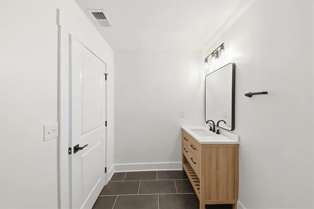 a view of a house with snow on the road