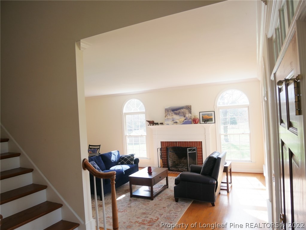 2035 North Moore Road Robbins, NC 27325 - Photo 5 of 16 a living room with furniture a fireplace and a large window