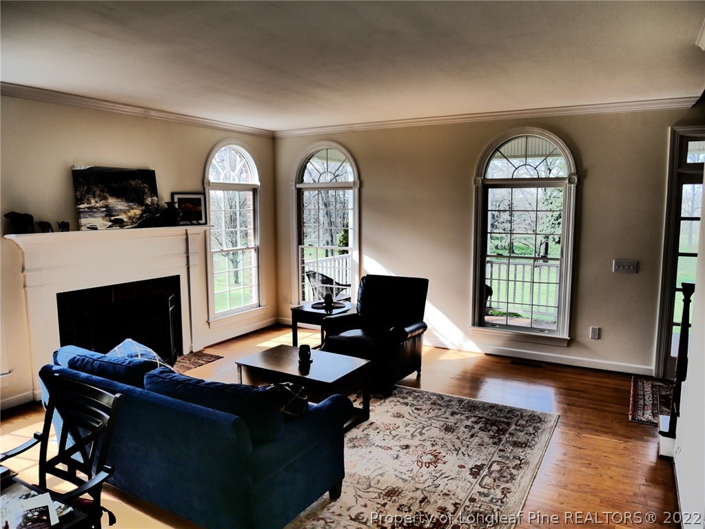 2035 North Moore Road Robbins, NC 27325 - Photo 6 of 16 a living room with furniture a fireplace and a table