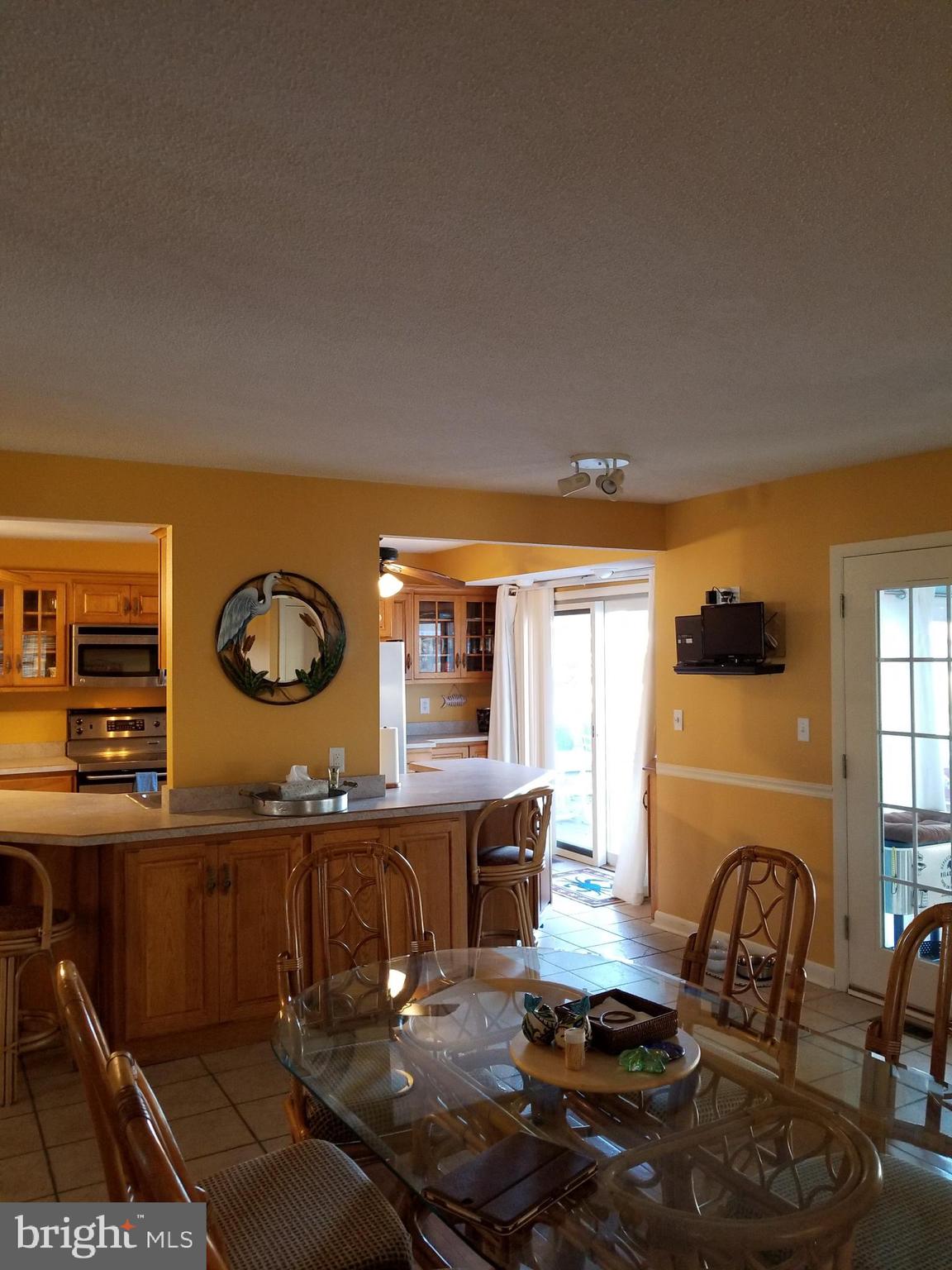 10600 Point Lookout Road Ocean City, MD 21842 - Photo 17 of 89 Dining area with counter top bar