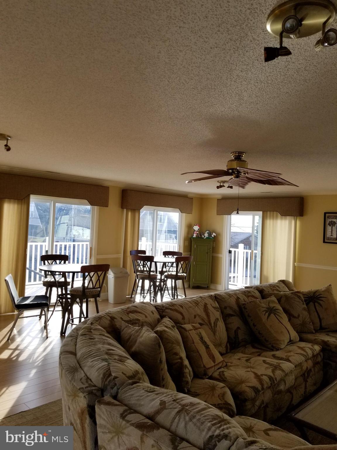 10600 Point Lookout Road Ocean City, MD 21842 - Photo 73 of 89 Great room (2nd level) with 5 sliders