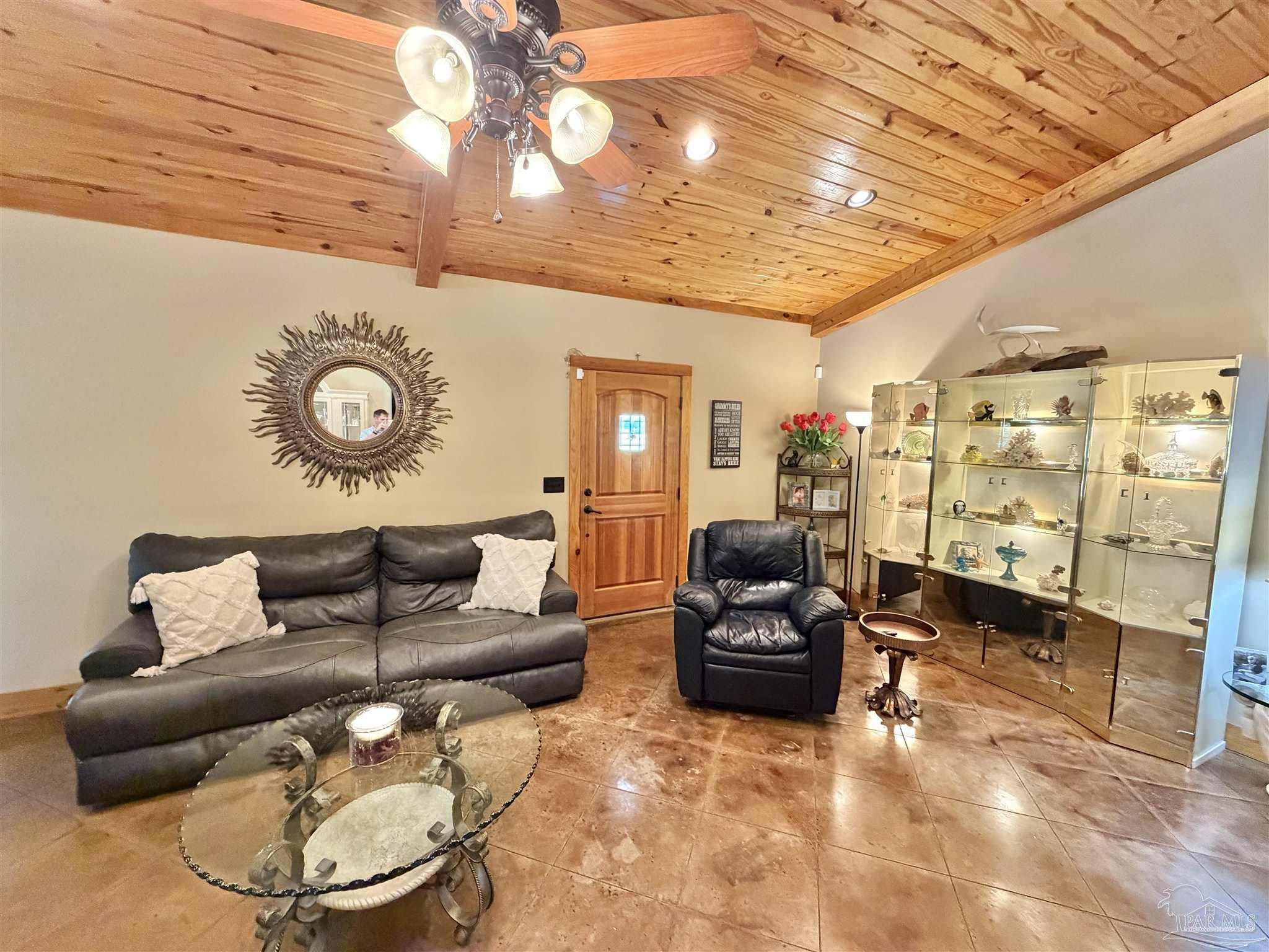 145 Tower Road Uriah, AL 36480 - Photo 11 of 72 a living room with furniture and a mirror