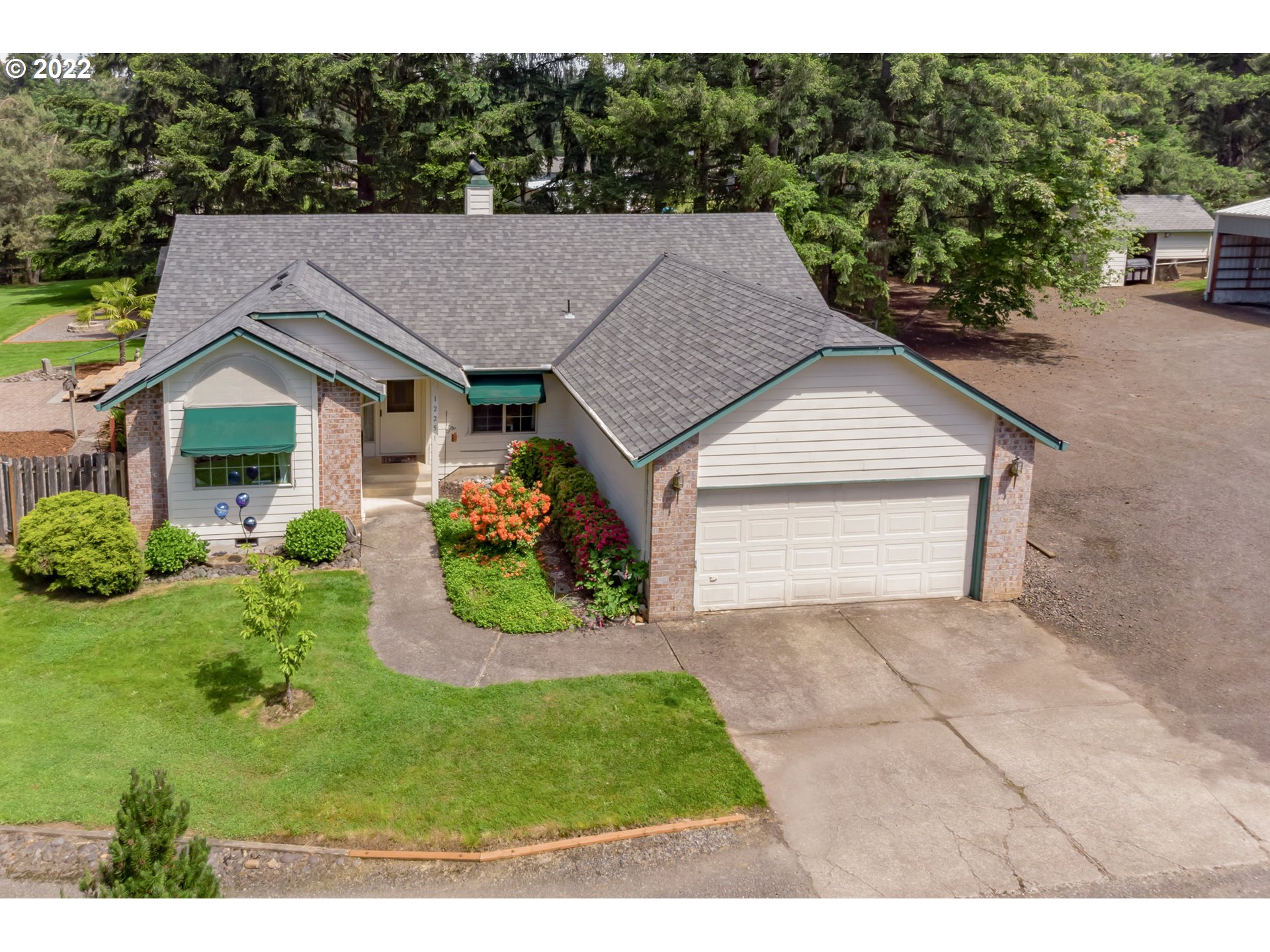 12251 Southeast Winston Road Damascus, OR 97089 - Photo 1 of 32 a aerial view of a house with yard and green space
