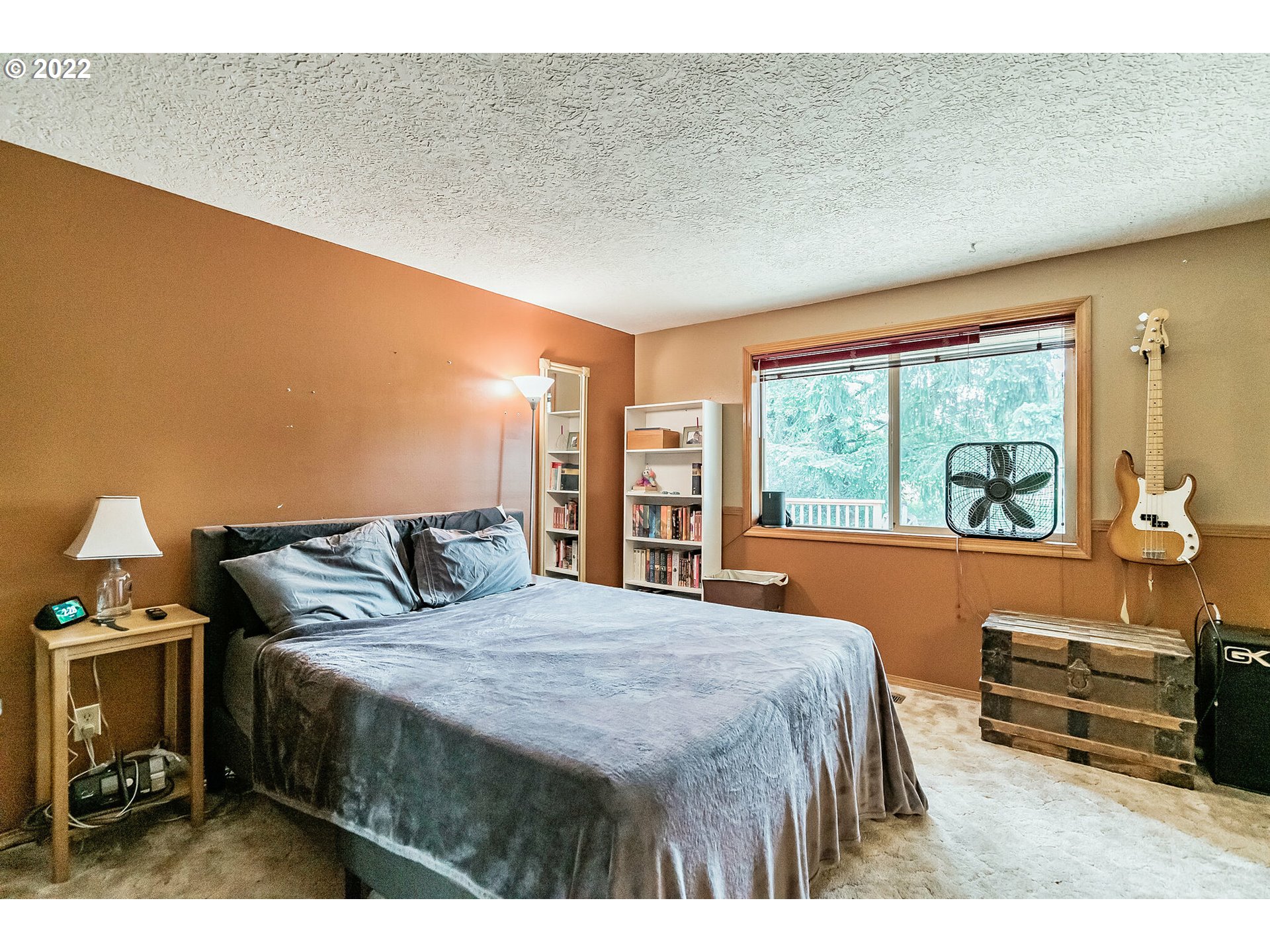 12251 Southeast Winston Road Damascus, OR 97089 - Photo 11 of 32 a bedroom with a bed and a dresser next to a window