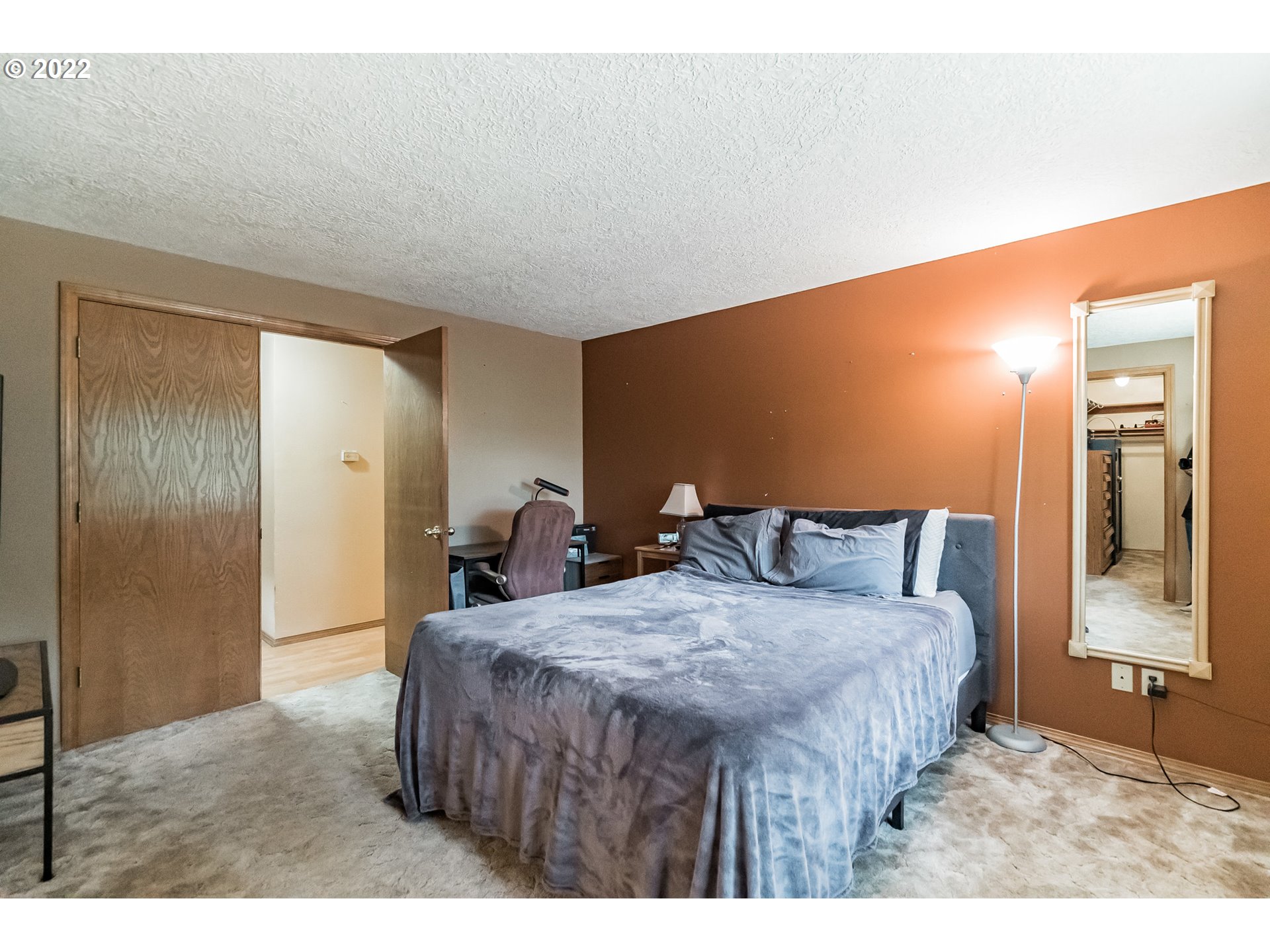 12251 Southeast Winston Road Damascus, OR 97089 - Photo 12 of 32 a bed room with a bed and a mirror