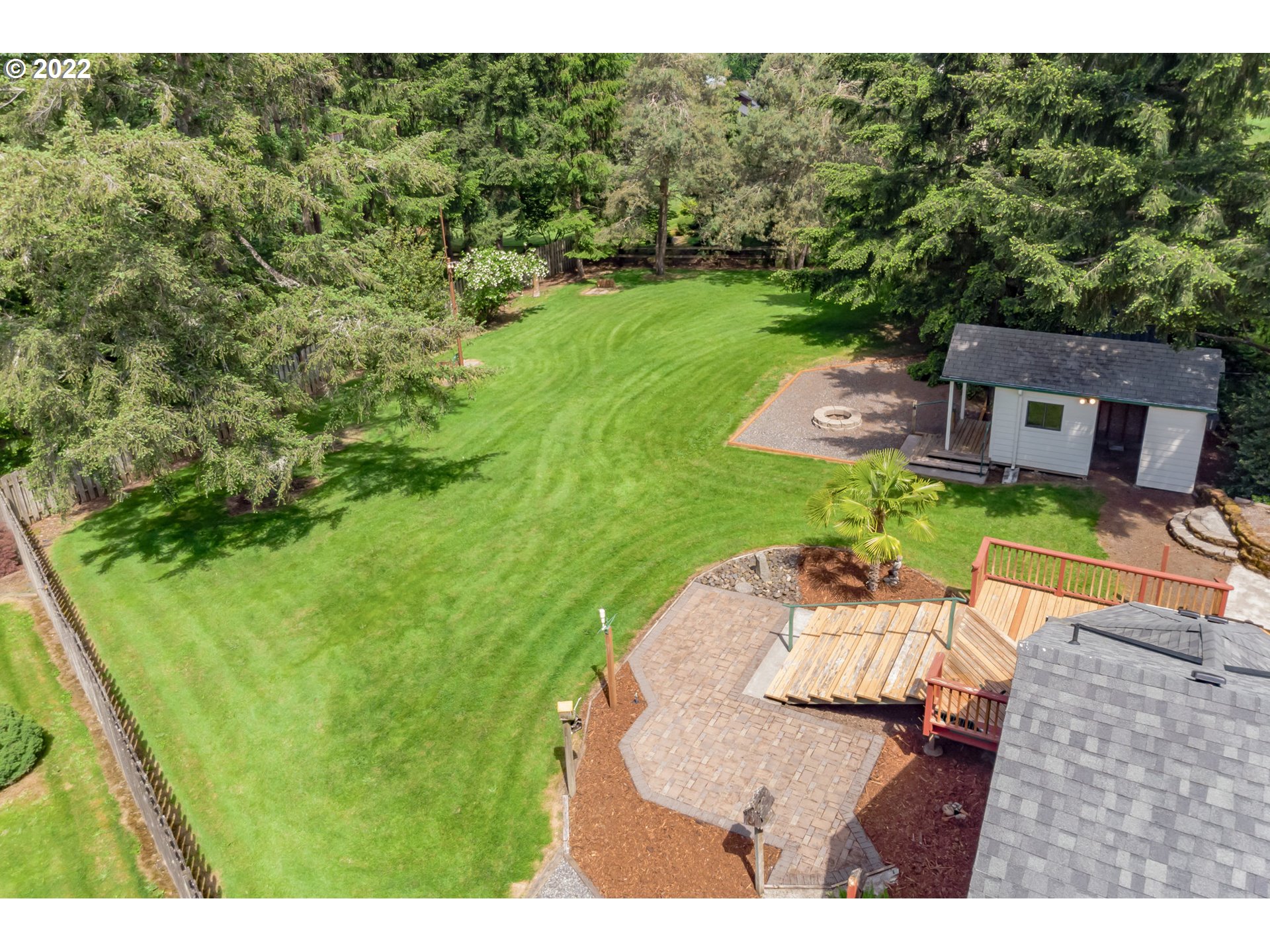 12251 Southeast Winston Road Damascus, OR 97089 - Photo 20 of 32 a backyard of a house with a yard and outdoor seating