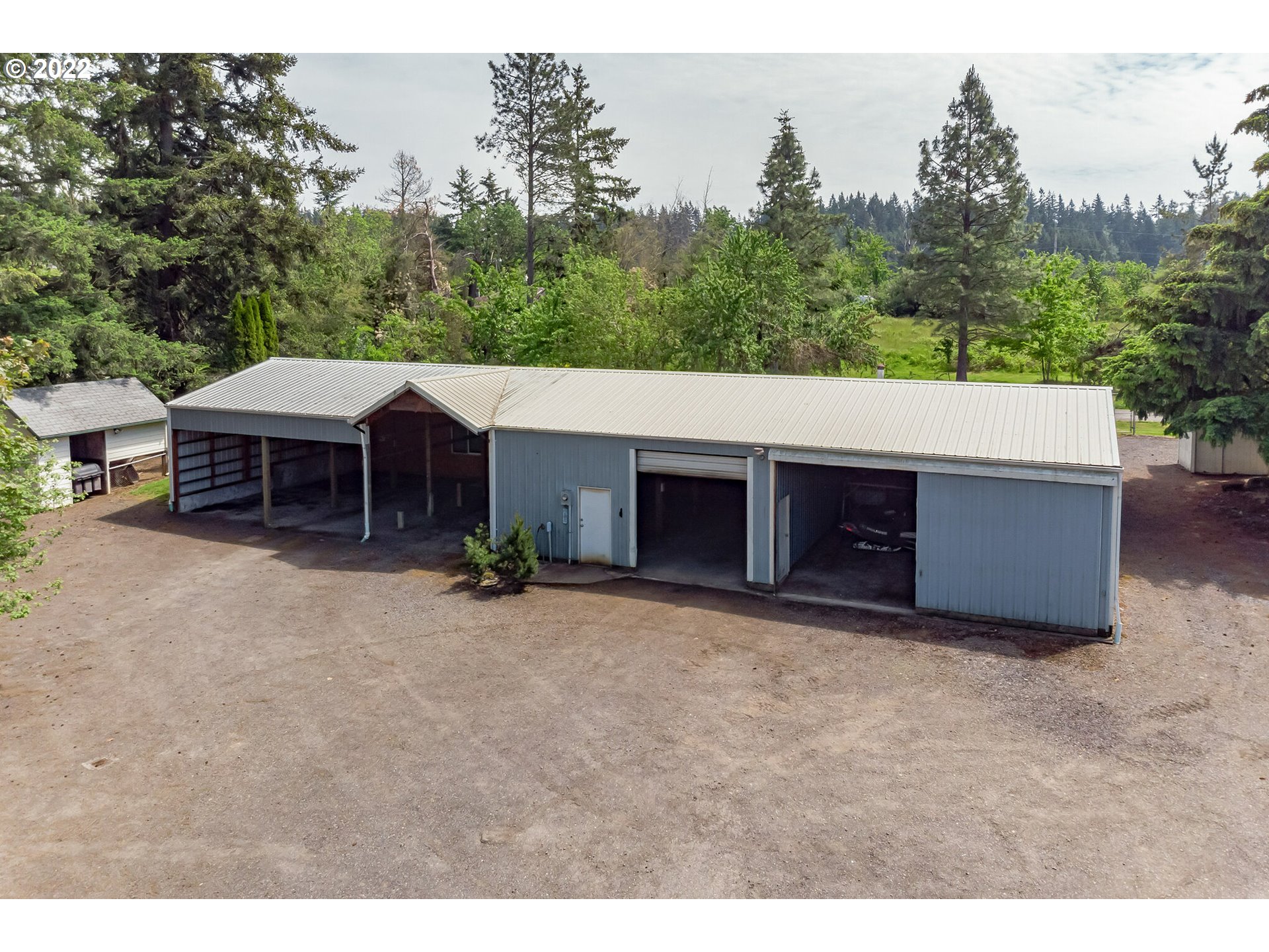 12251 Southeast Winston Road Damascus, OR 97089 - Photo 24 of 32 a view of a house with a backyard and a patio