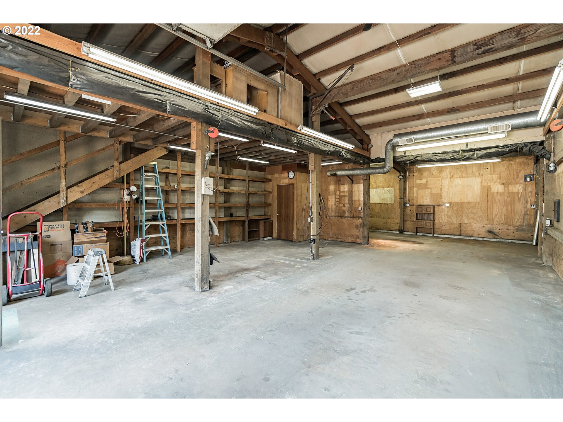 12251 Southeast Winston Road Damascus, OR 97089 - Photo 26 of 32 a view of an empty room with wooden roof