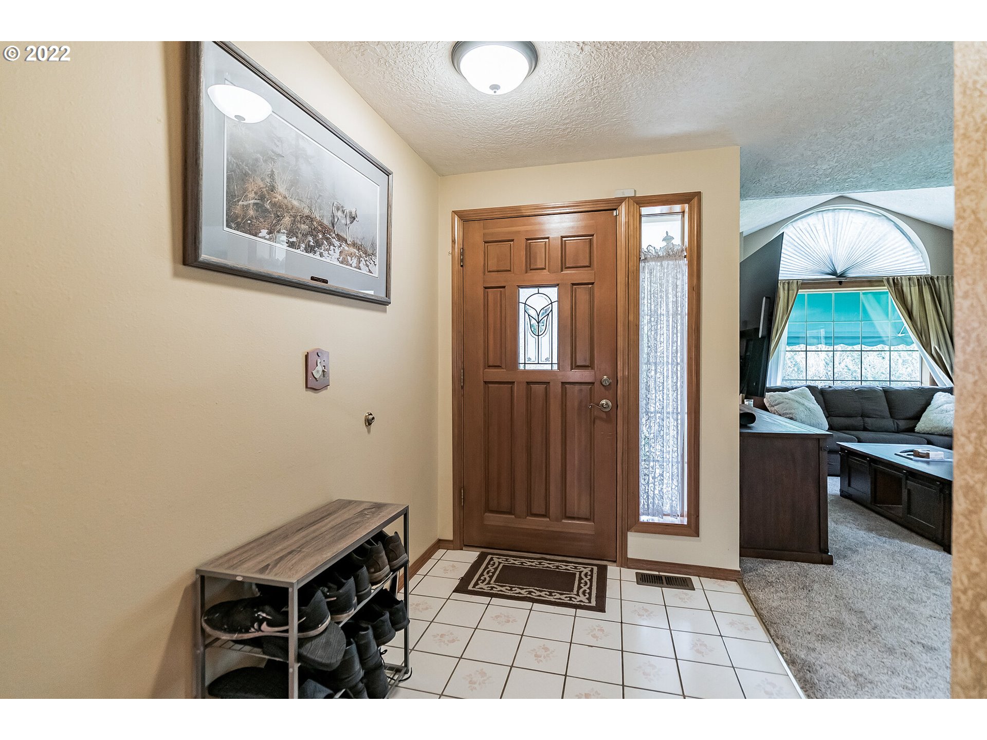12251 Southeast Winston Road Damascus, OR 97089 - Photo 3 of 32 a room with painting and a table