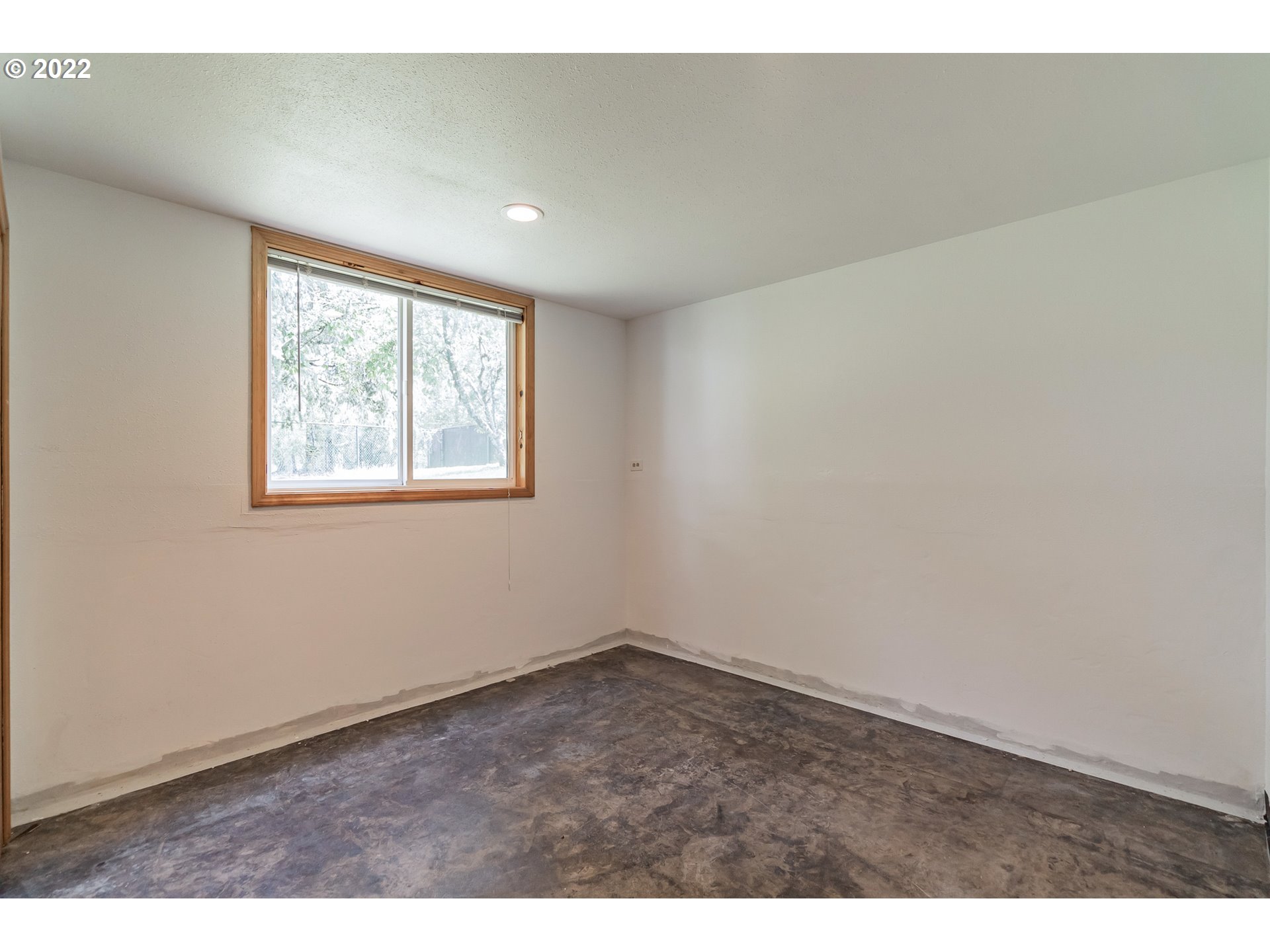 12251 Southeast Winston Road Damascus, OR 97089 - Photo 31 of 32 an empty room with windows