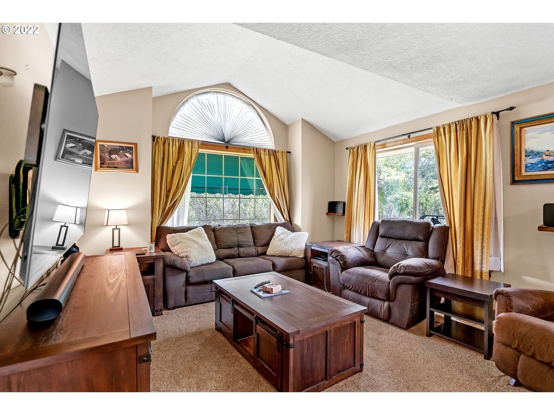 12251 Southeast Winston Road Damascus, OR 97089 - Photo 4 of 32 a living room with furniture and a large window
