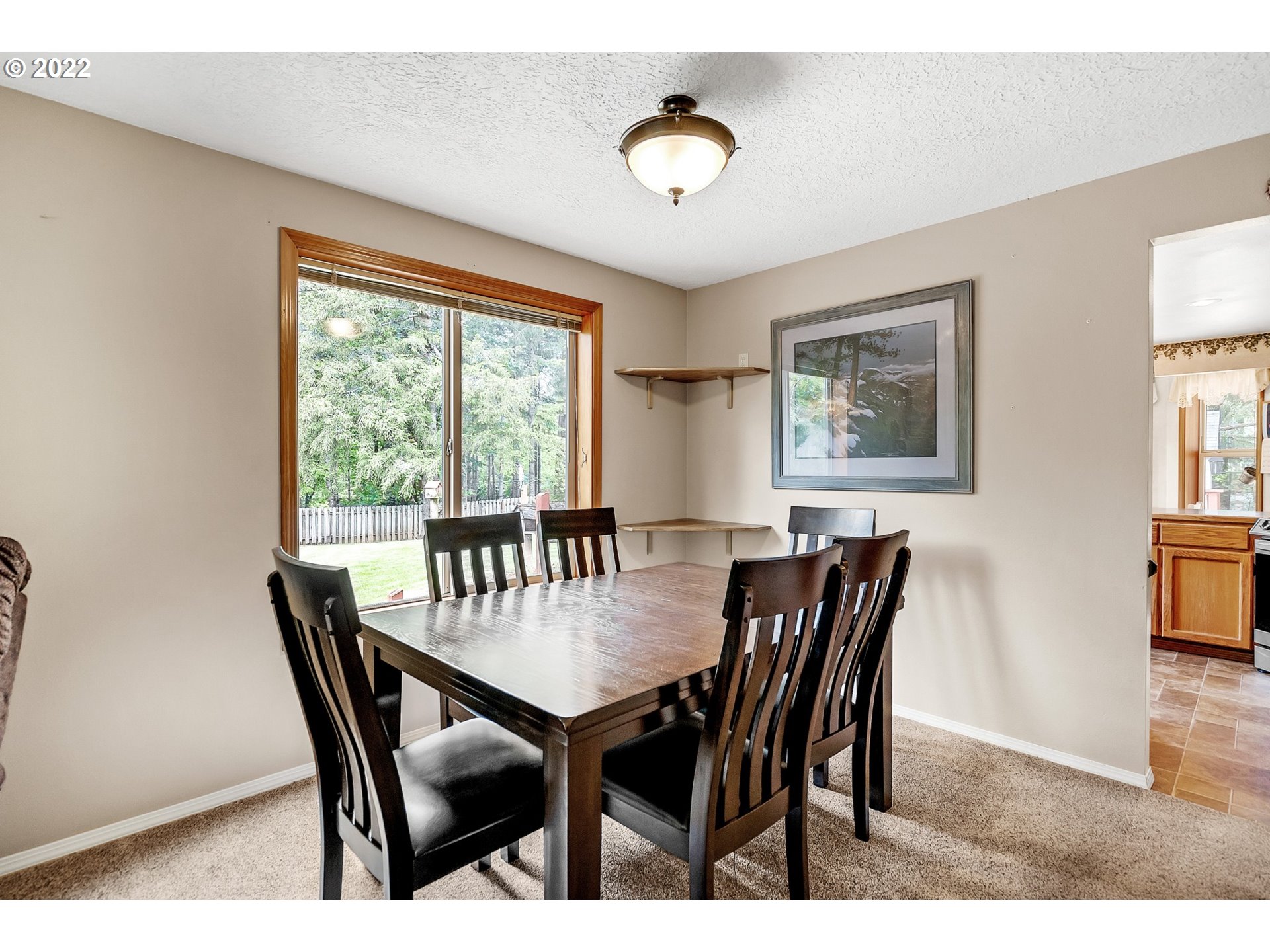 12251 Southeast Winston Road Damascus, OR 97089 - Photo 6 of 32 a view of a dining room with furniture and chandelier