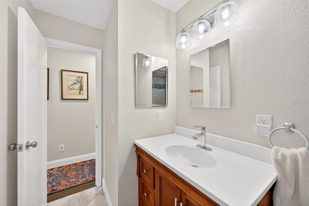 1024 Timor Avenue Orlando, FL 32804 - Photo 19 of 51 a bathroom with a sink vanity and a mirror
