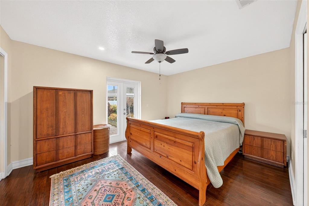1024 Timor Avenue Orlando, FL 32804 - Photo 21 of 51 a bed room with a bed and a ceiling fan