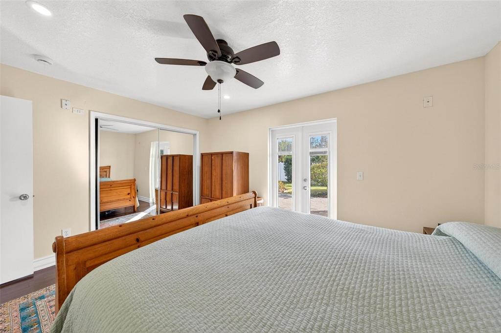 1024 Timor Avenue Orlando, FL 32804 - Photo 23 of 51 a bedroom with a large bed and a large window