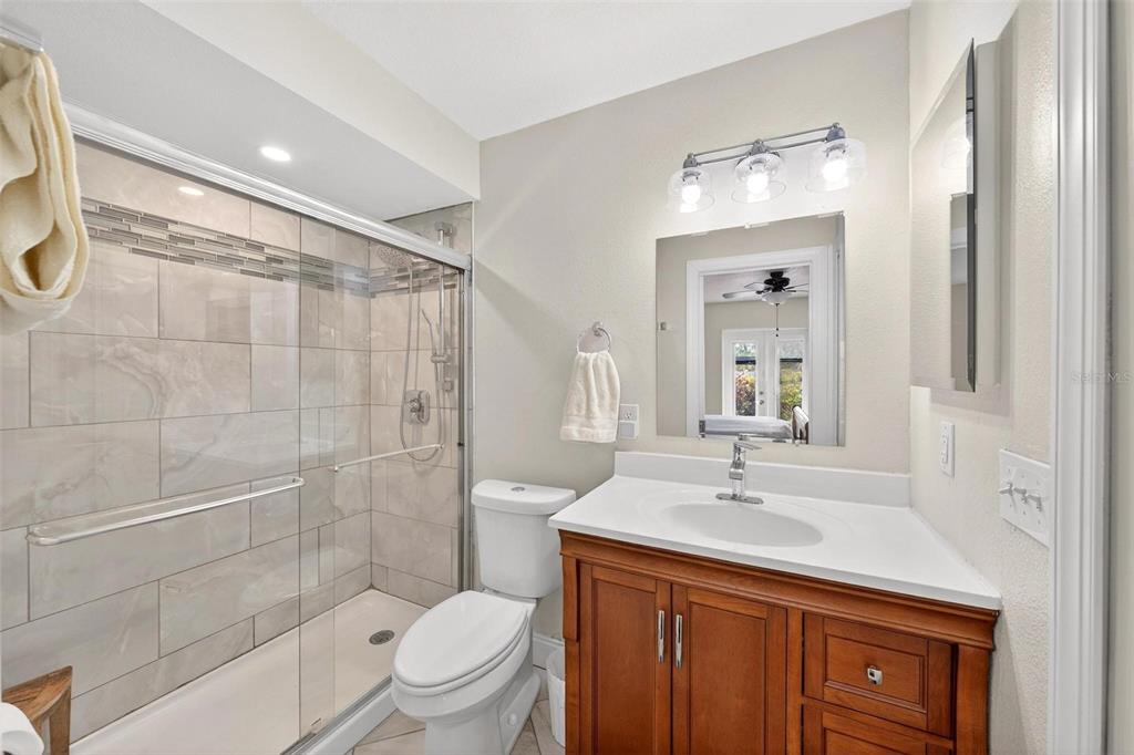 1024 Timor Avenue Orlando, FL 32804 - Photo 25 of 51 a bathroom with a sink a toilet and shower